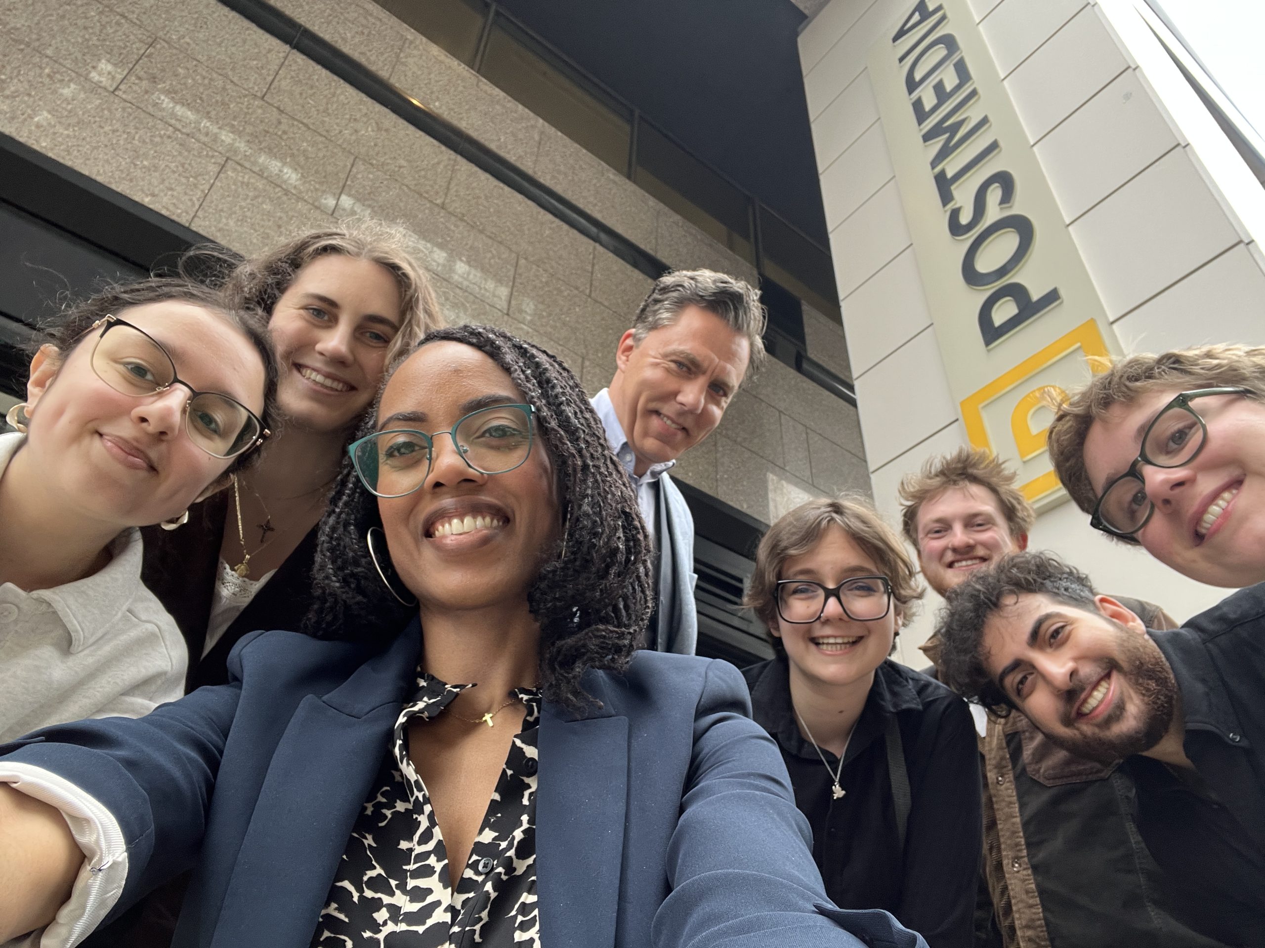 The IJB gathers outside of the Postmedia sign